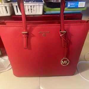New red Mk purse.